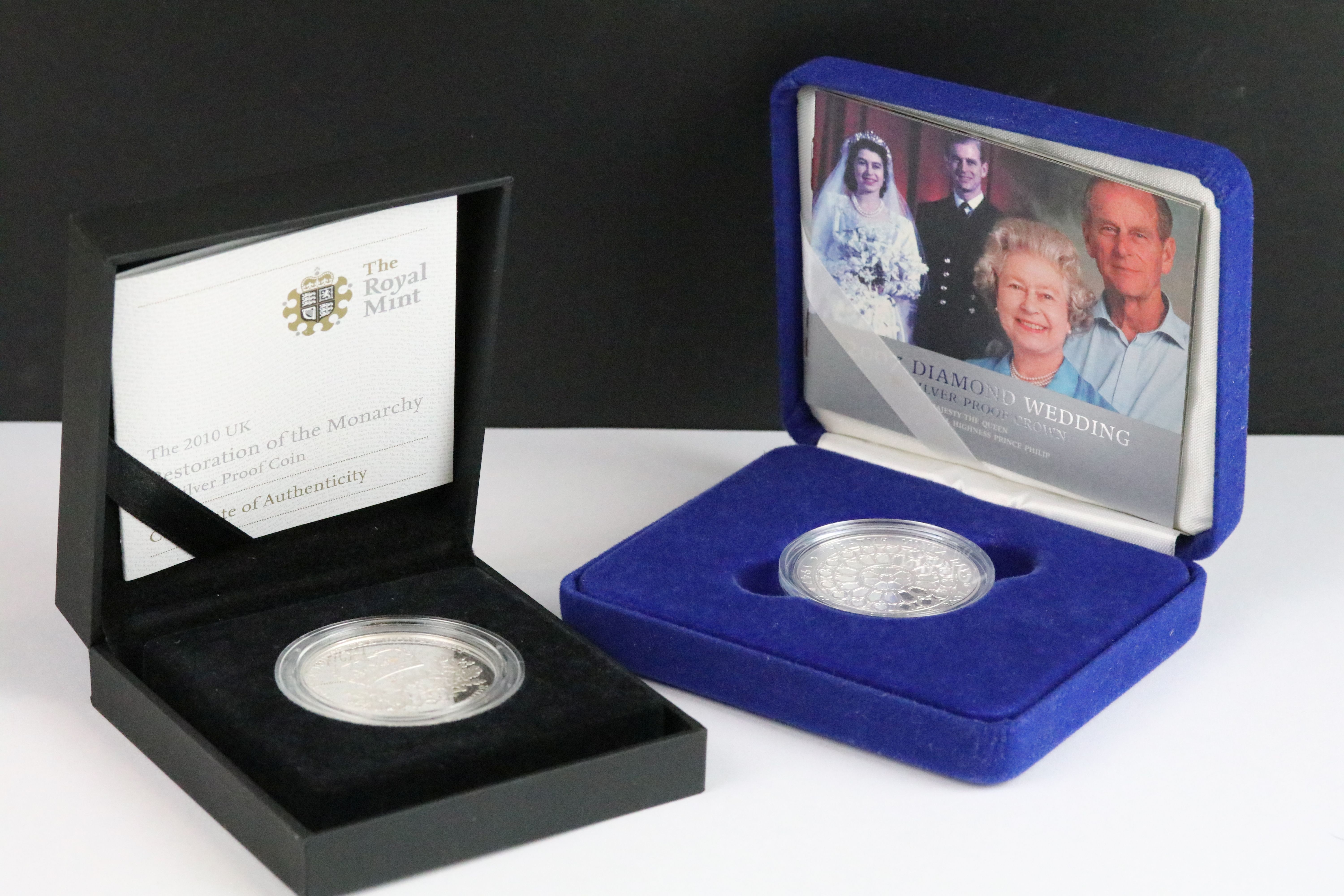 A British Royal Mint 2007 Diamond Wedding silver proof crown coin together with a 2010 Restoration