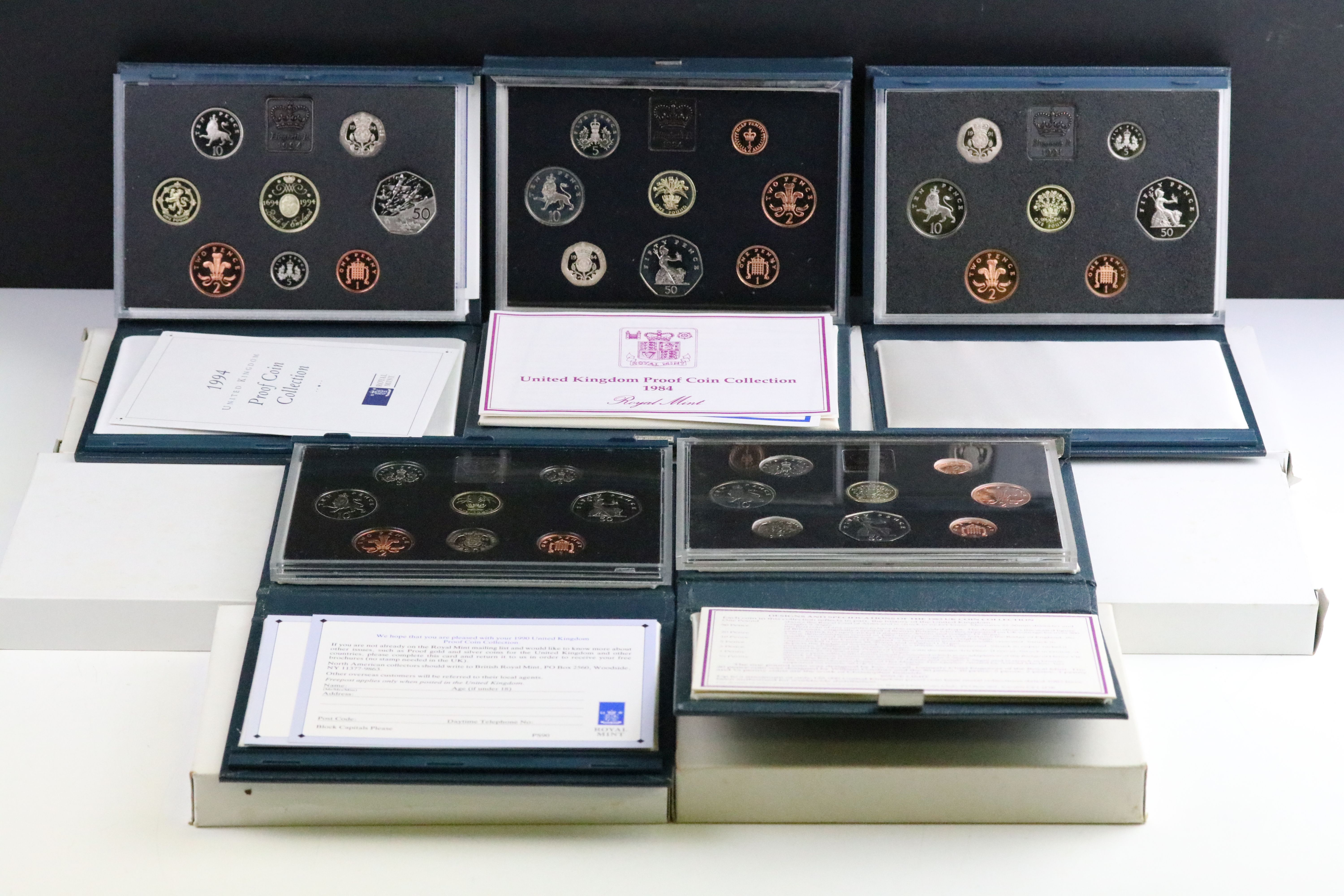 A collection of eight United Kingdom Royal Mint proof year sets to include 1984, 1993, 1991, 1997.