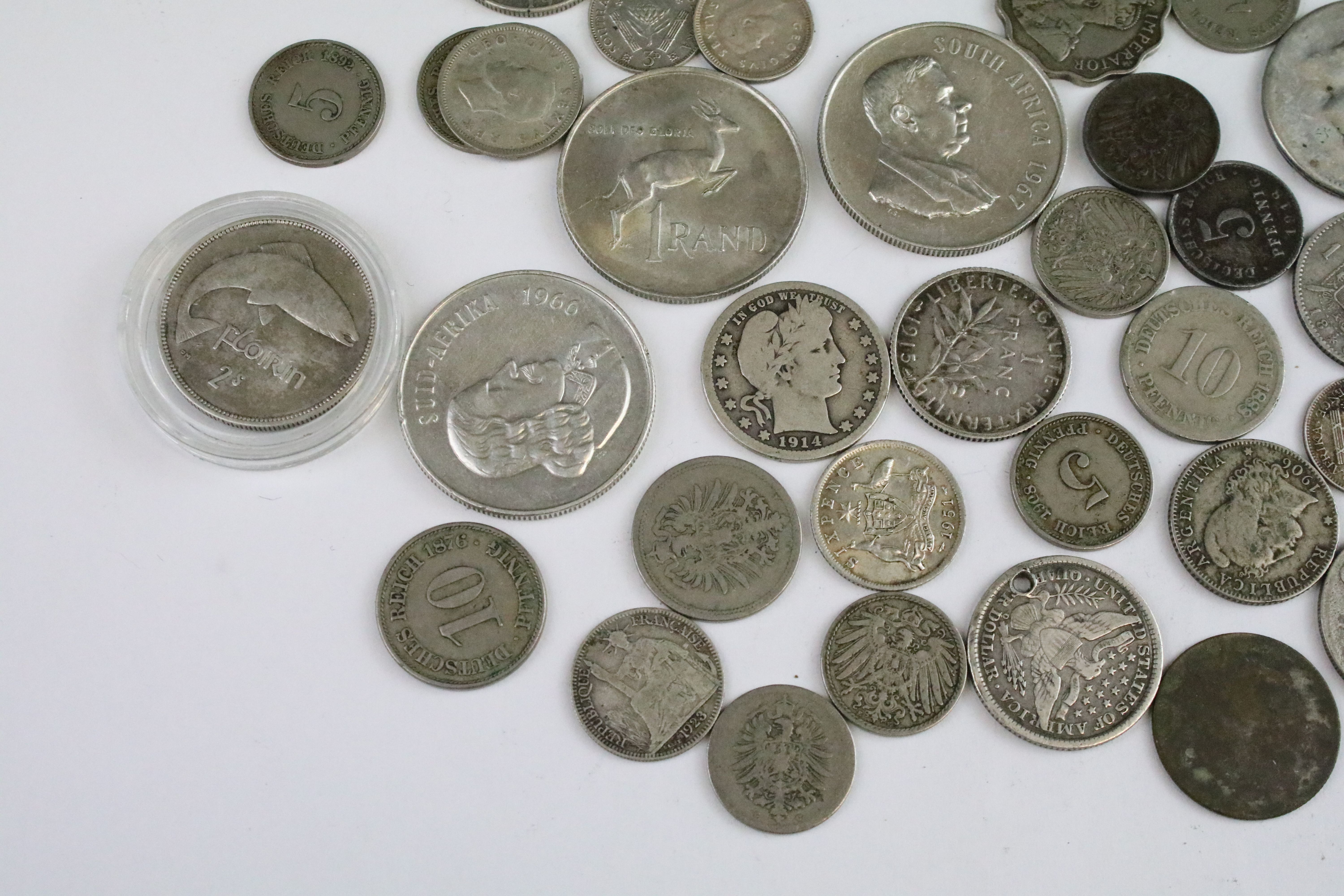 A collection of circulated world silver coins to include United States, German and India examples. - Image 2 of 9
