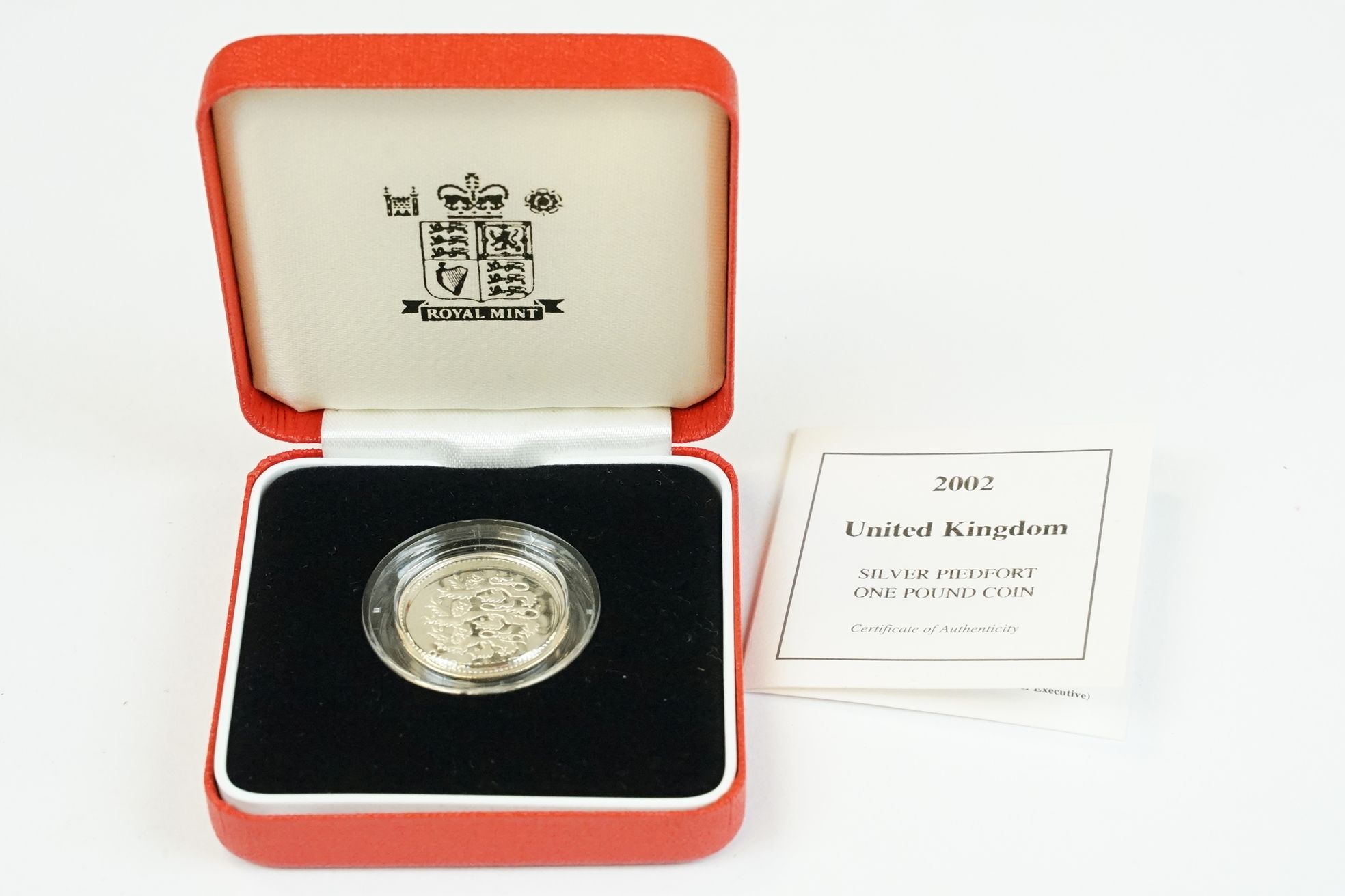 A collection of four Royal Mint silver proof £1 coins to include 2002, 1985, 1983 and 1988 examples, - Image 11 of 13