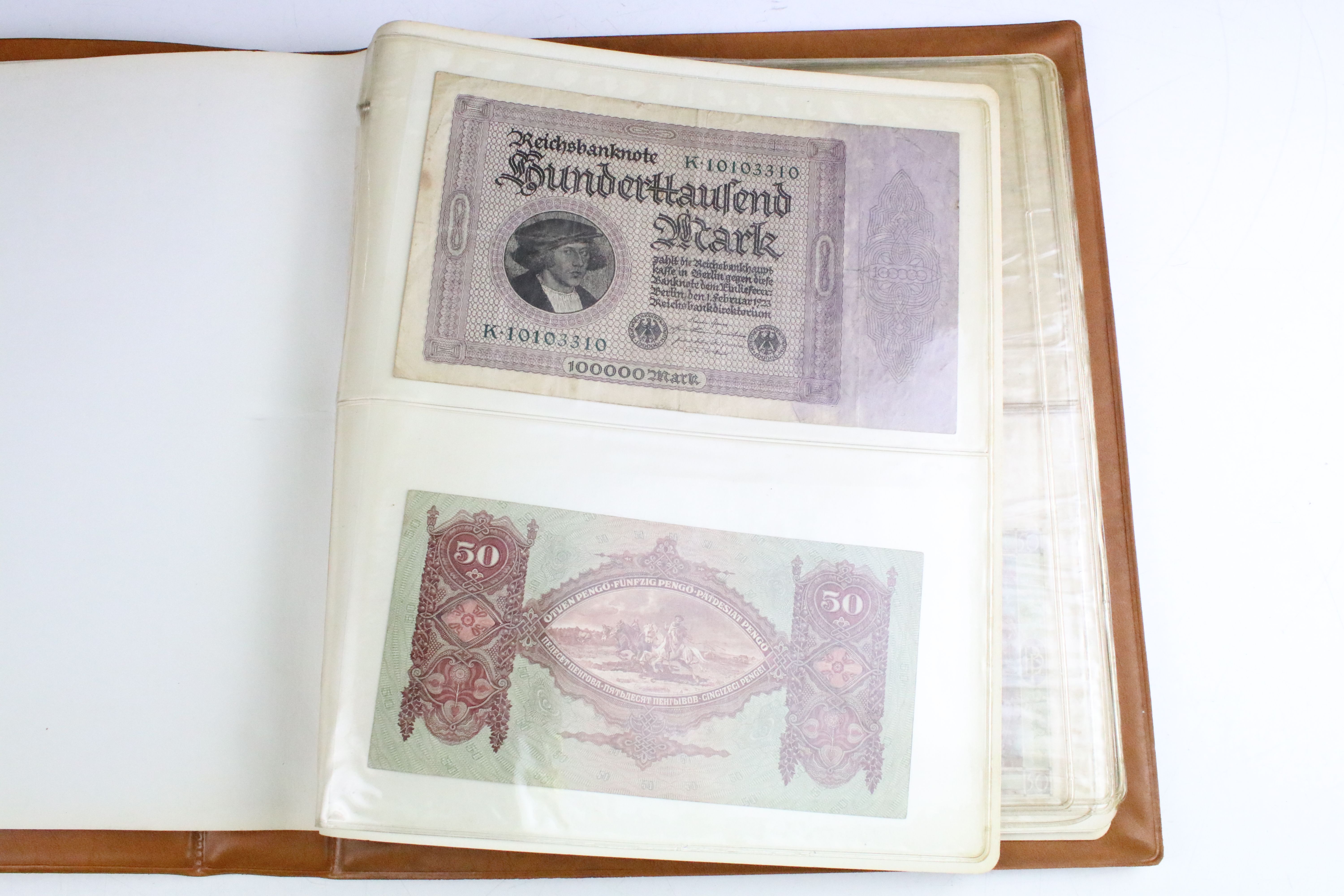 A small collection of British and World banknotes contained within a collectors album. - Image 3 of 9