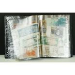 A collection of British and World banknotes contained within a folder to include China, Germany,