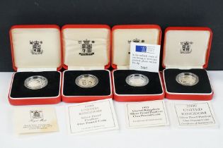 A collection of four Royal Mint silver proof £1 coins to include 2000, 1993, 1989 and 1999 examples,