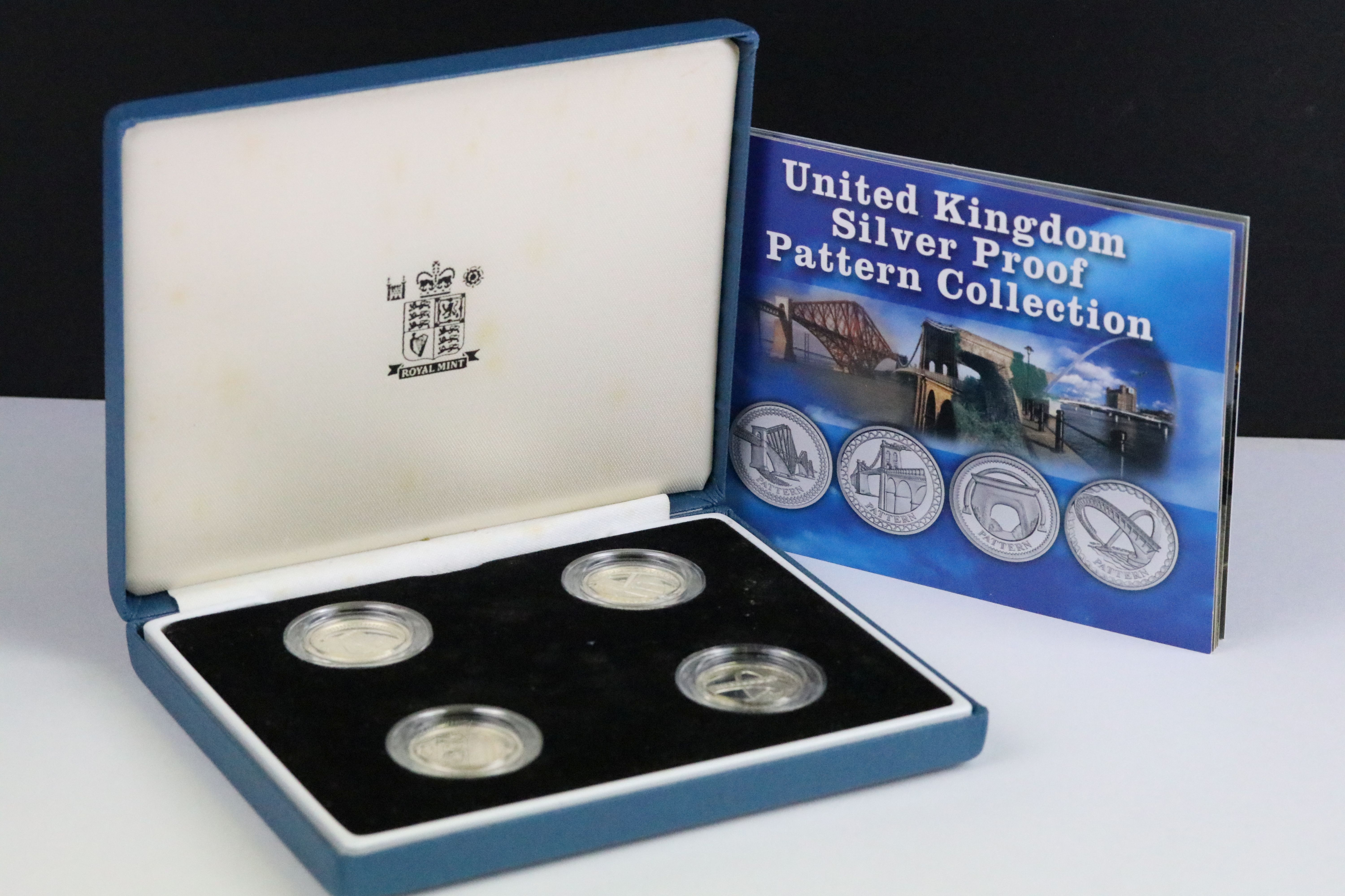 A Royal Mint United Kingdom silver proof £1 four coin pattern collection encapsulted within fitted