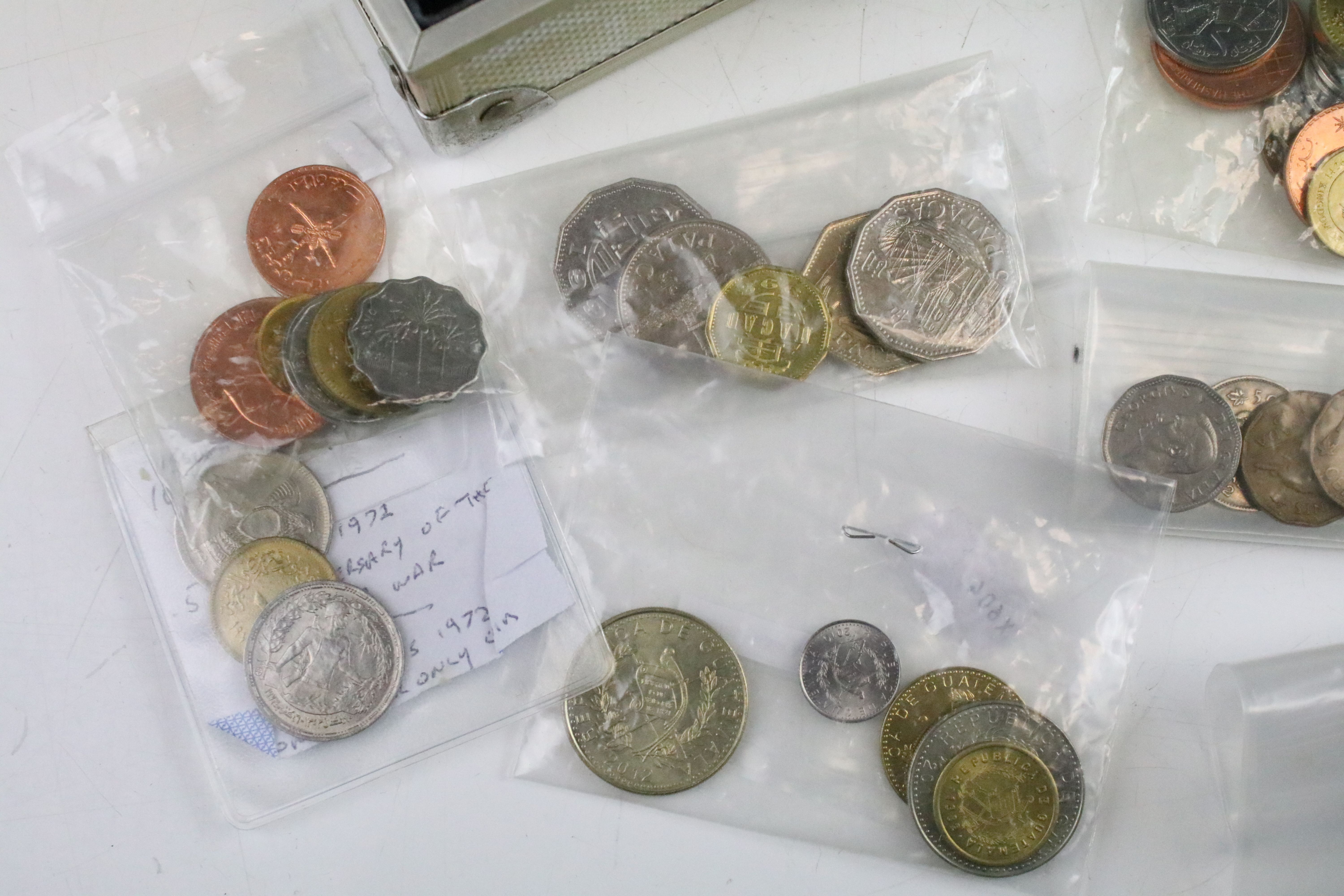 A collection of British pre decimal and World coins contained within an aluminium collectors case. - Image 4 of 11