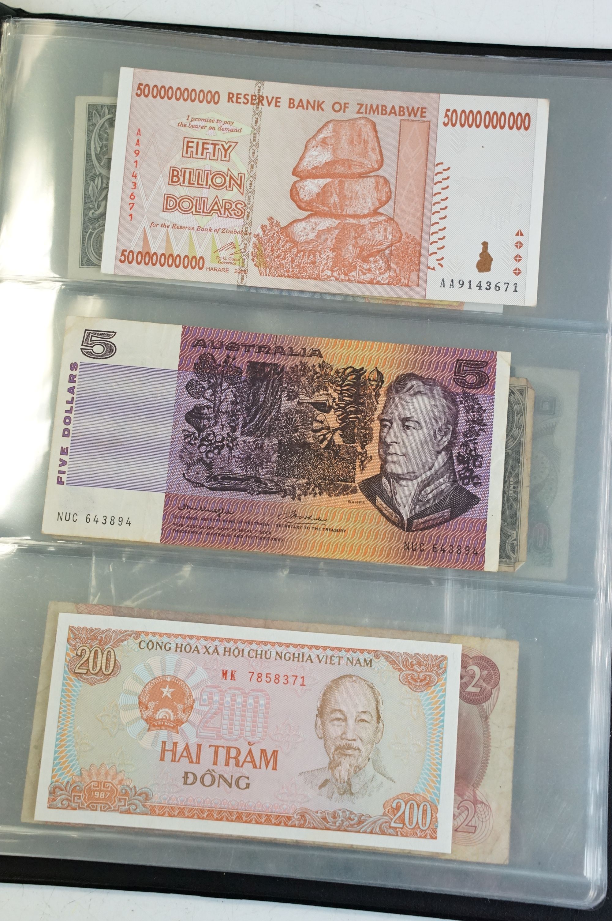 A collection of circulated and uncirculated world banknotes within a collectors folder to include - Image 3 of 12