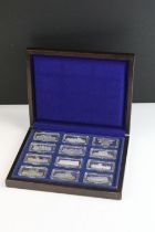 A cased set of twelve silver ingots representing British castles, each individualy hallmarked a