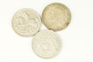 A collection of three British silver crown coins to include two 1935 examples together with a 1937