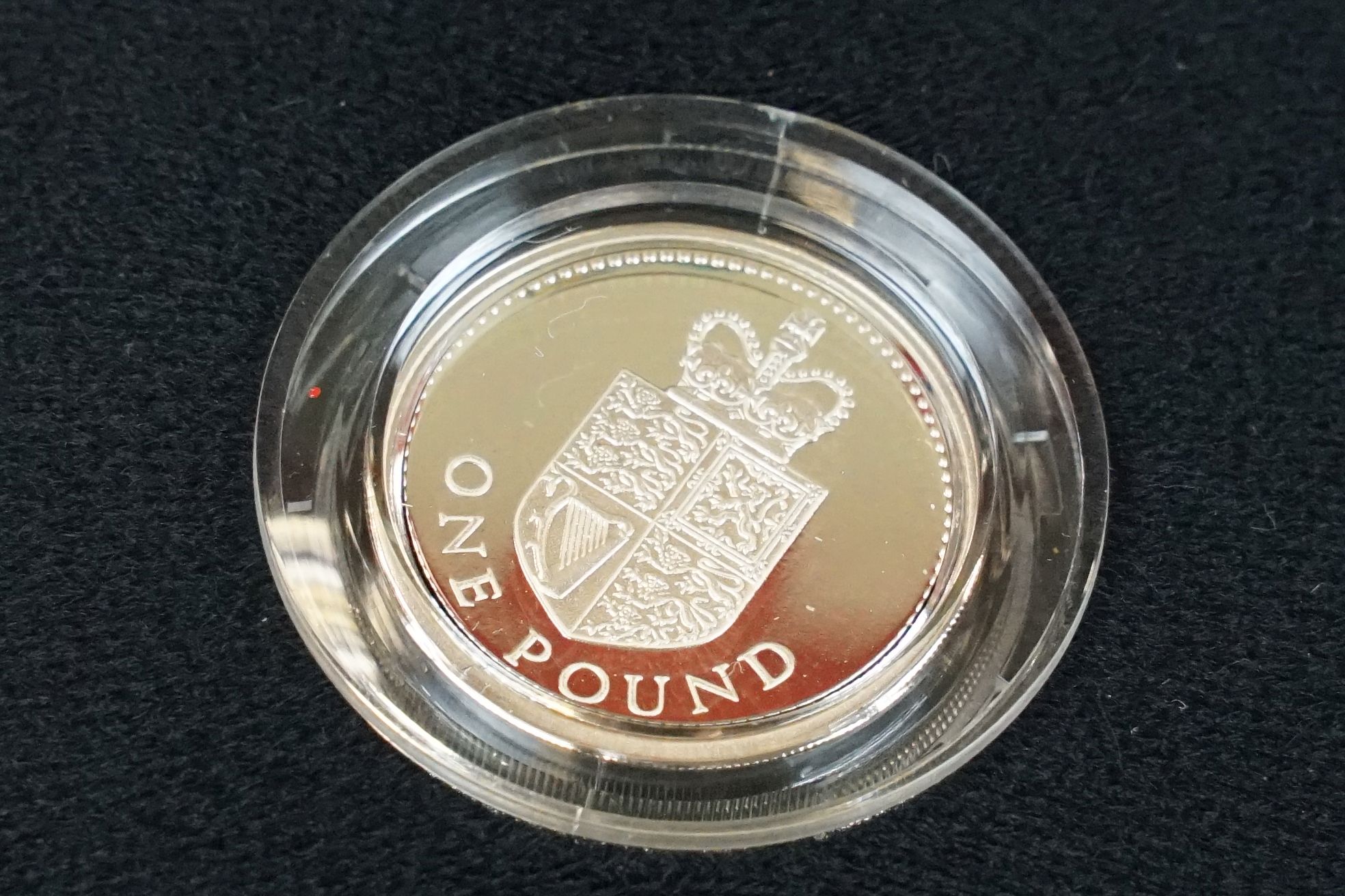 A collection of four Royal Mint silver proof £1 coins to include 2002, 1985, 1983 and 1988 examples, - Image 9 of 13