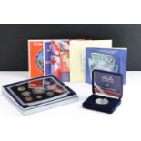 A collection of eight Royal Mint uncirculated coin year sets to include 2000, 2001, 2002, 1986,