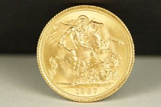 A British Queen Elizabeth II 1967 gold full sovereign coin.