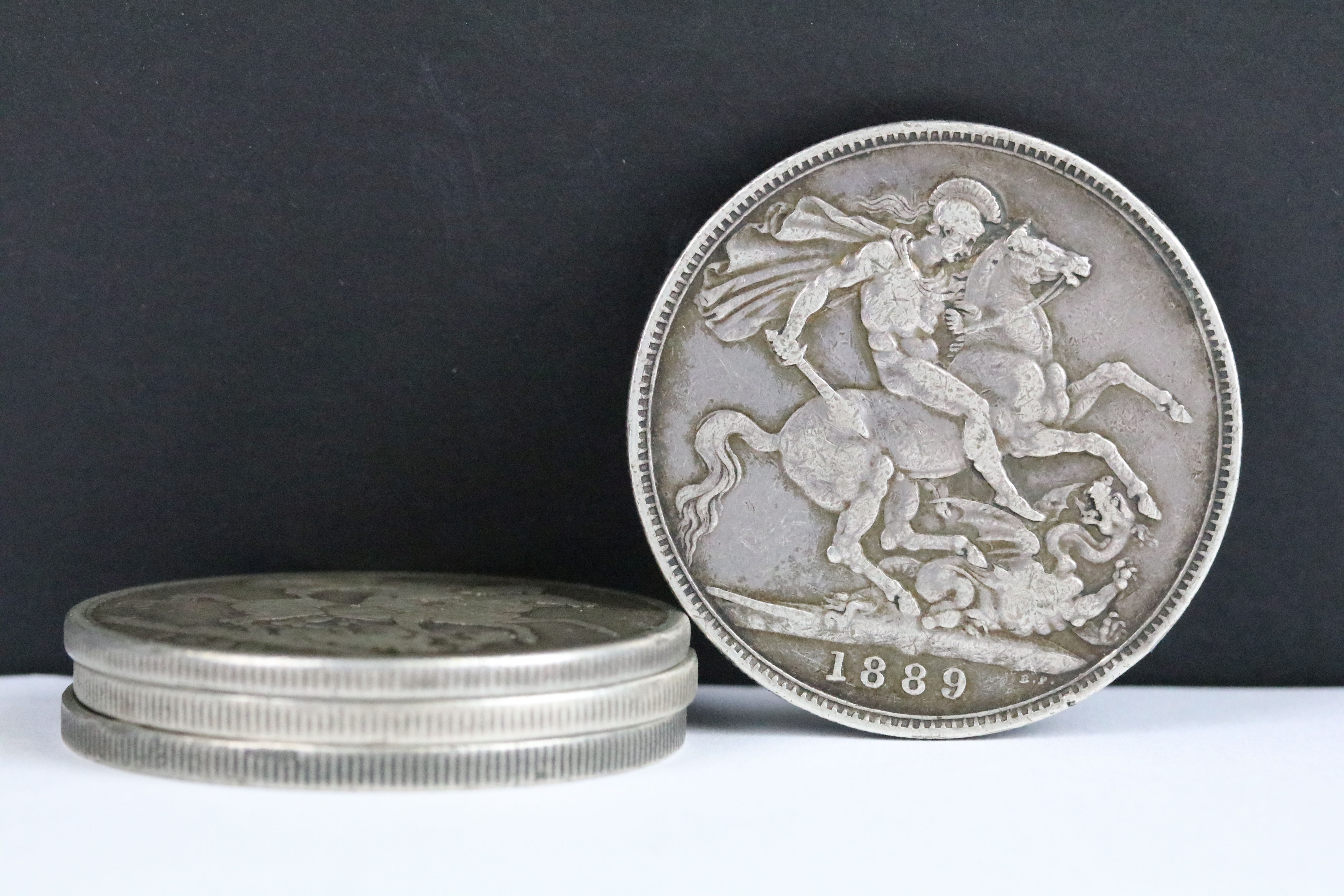 A collection of four British Queen Victoria pre decimal silver full crown coins to include 1889,
