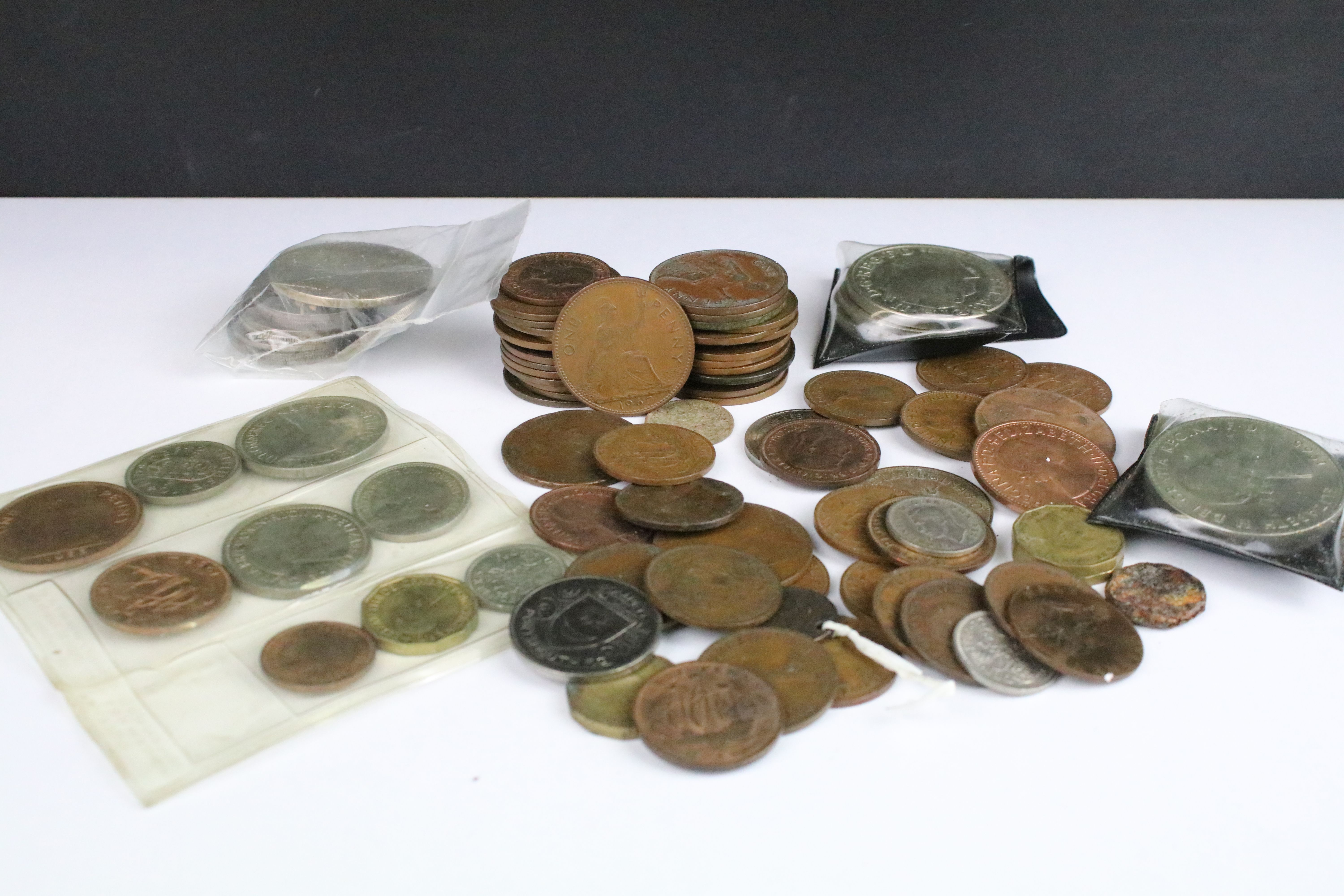 A small collection of British pre decimal coins to include silver crown and half crown examples.