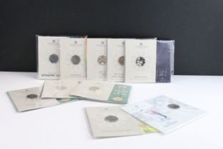 A collection of ten Royal Mint uncirculated collectors 50p coin packs to include The Snowman,