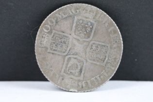 A British Queen Anne 1709 silver shilling coin.