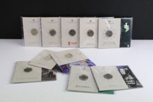 A collection of Ten Royal Mint uncirculated collectors £2 coin packs to include H.G. Wells, Sir