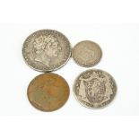 A small group of four British pre decimal coins to include a King George III 1819 full silver