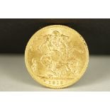 A British King George V 1913 gold full sovereign coin.