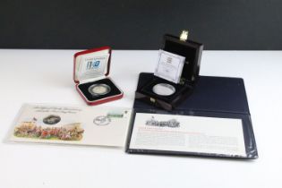A collection of three silver proof coins to include a 2000 50p coin, 2012 £5 coin and a 1979