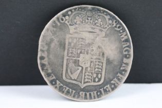A British William & Mary 1689 silver half crown coin.