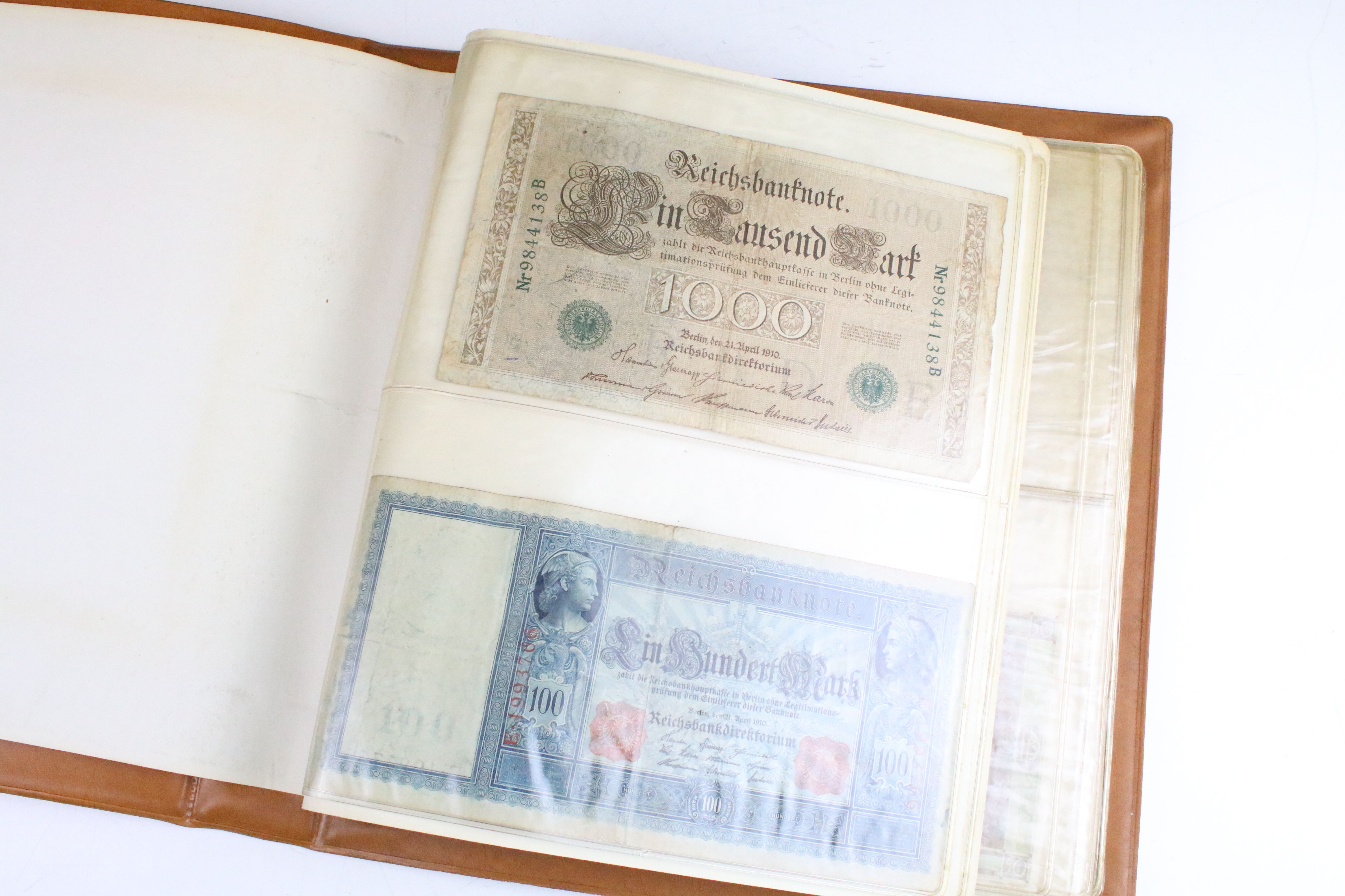 A small collection of British and World banknotes contained within a collectors album. - Image 2 of 9