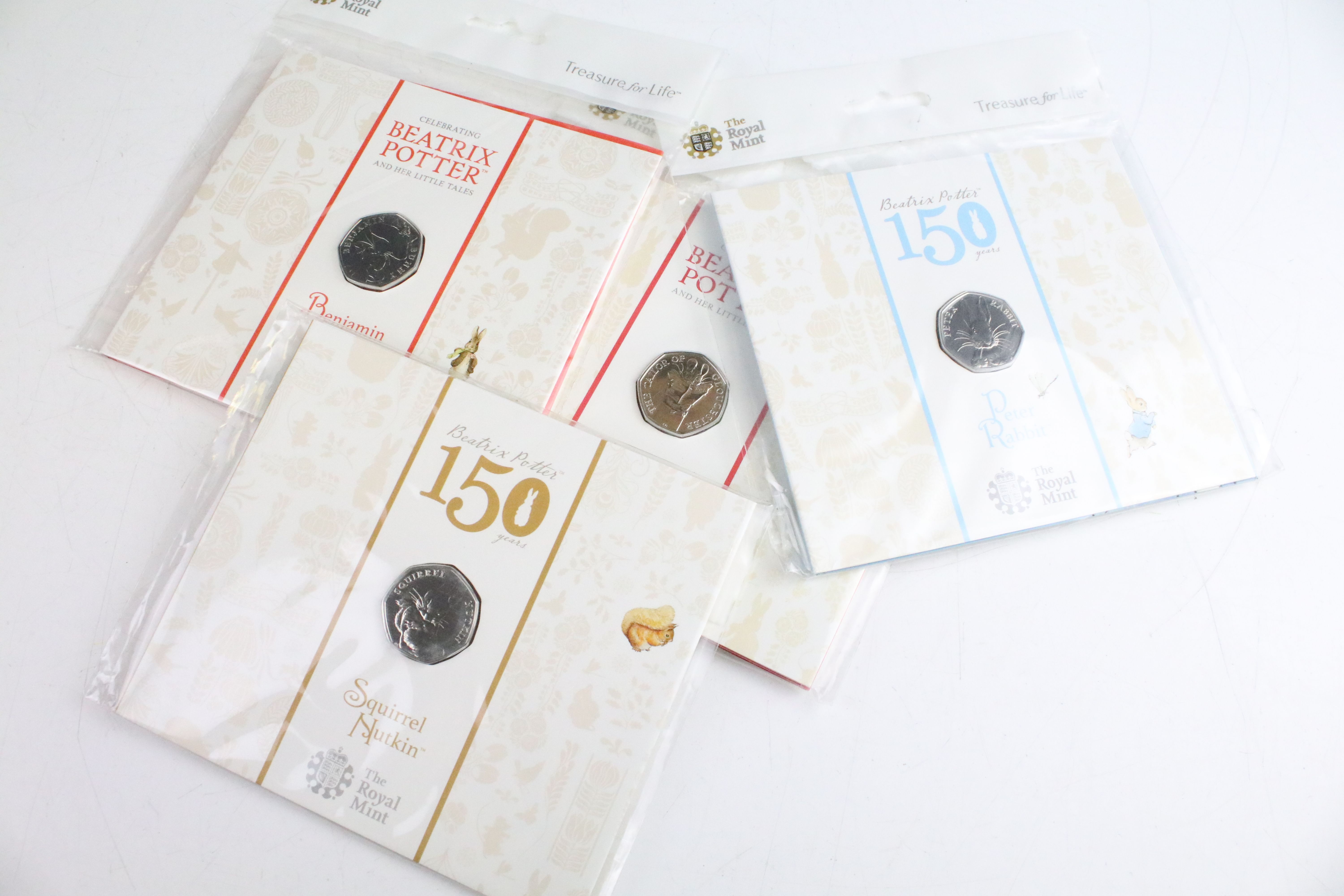 A collection of fifteen Royal Mint Beatrix Potter 50p coin collectors packs together with five - Bild 4 aus 8