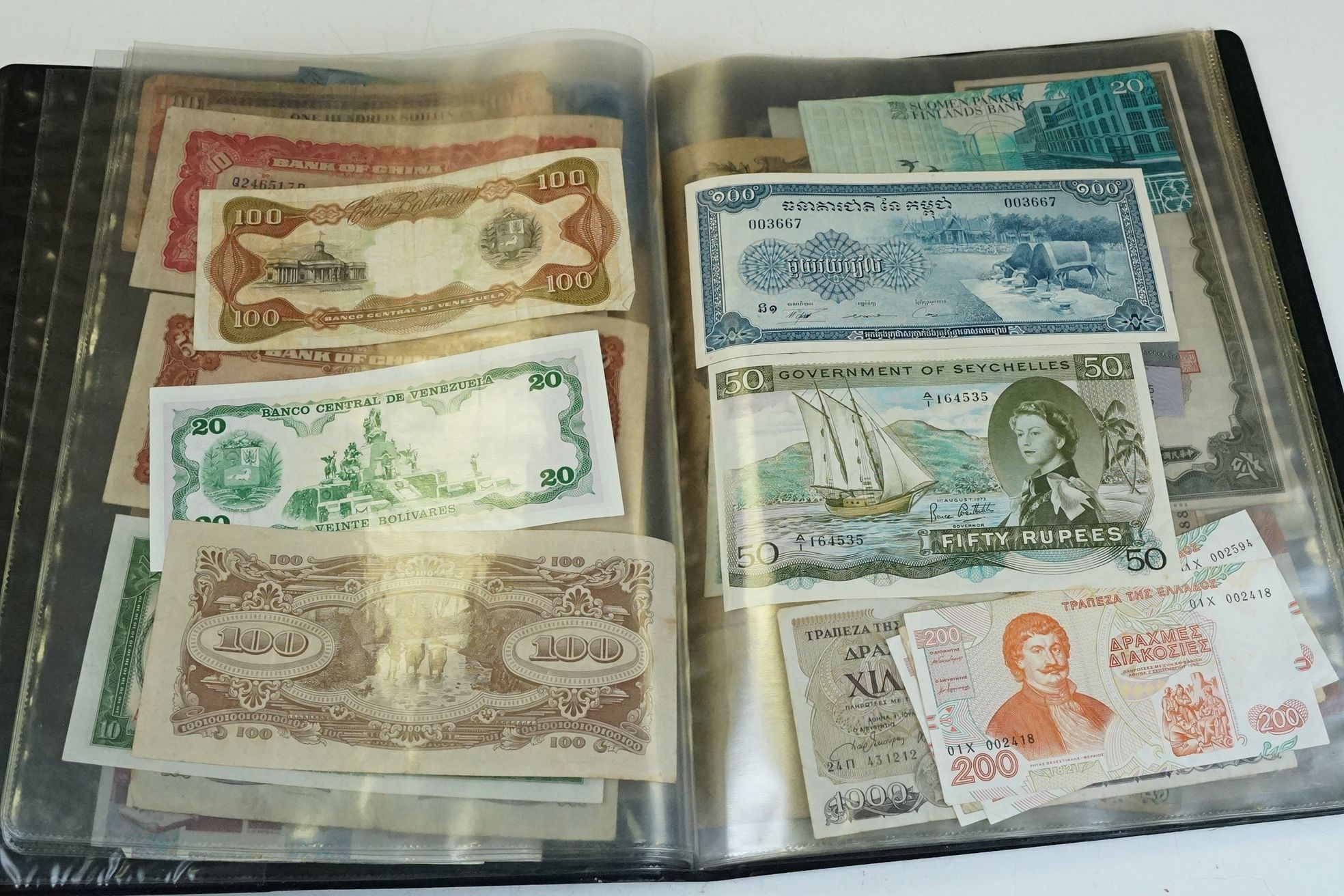 A collection of British and World banknotes contained within a folder to include China, Germany, - Image 6 of 19
