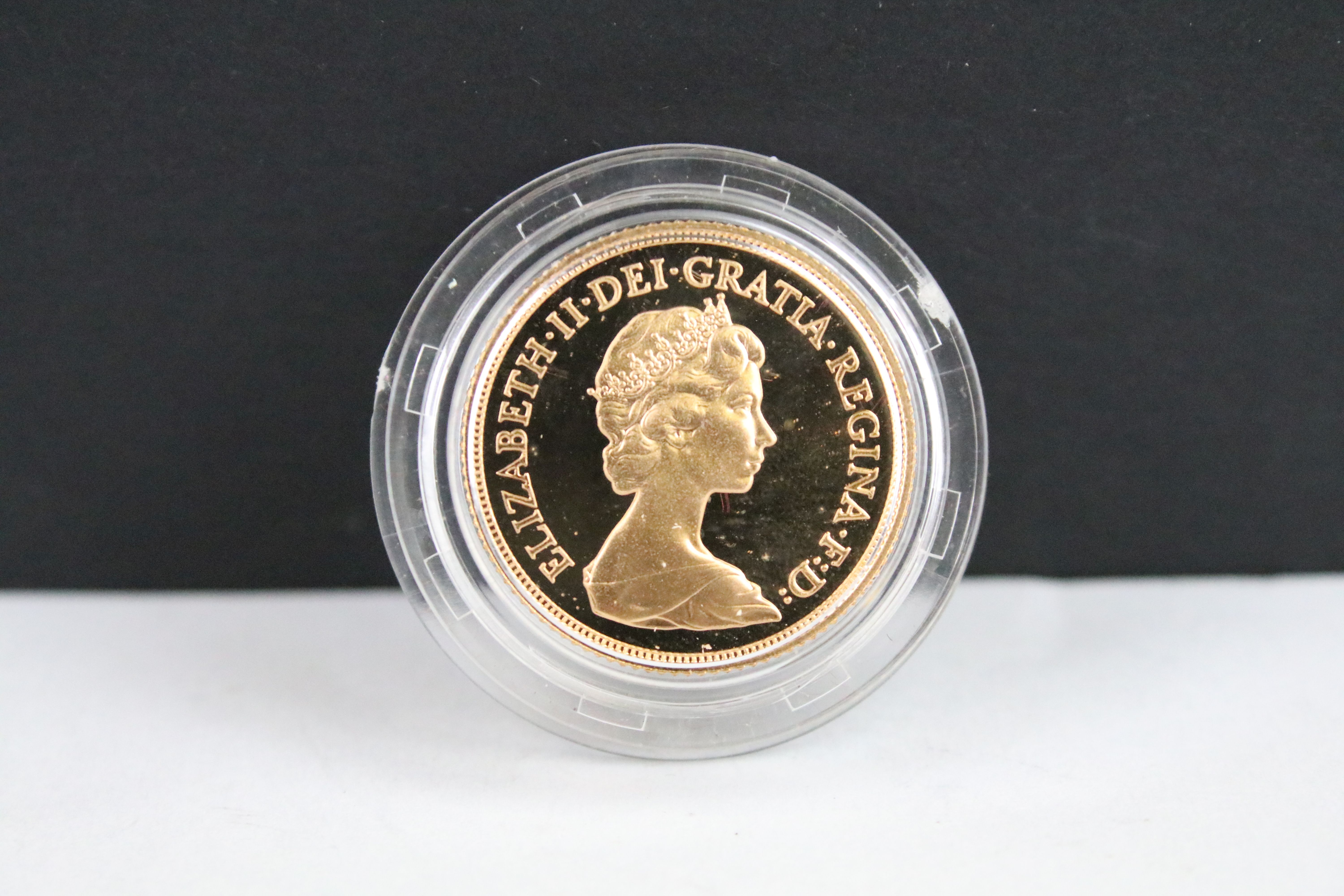 A British Royal Mint Queen Elizabeth II proof 1984 gold full sovereign coin encapsulated within - Image 3 of 4