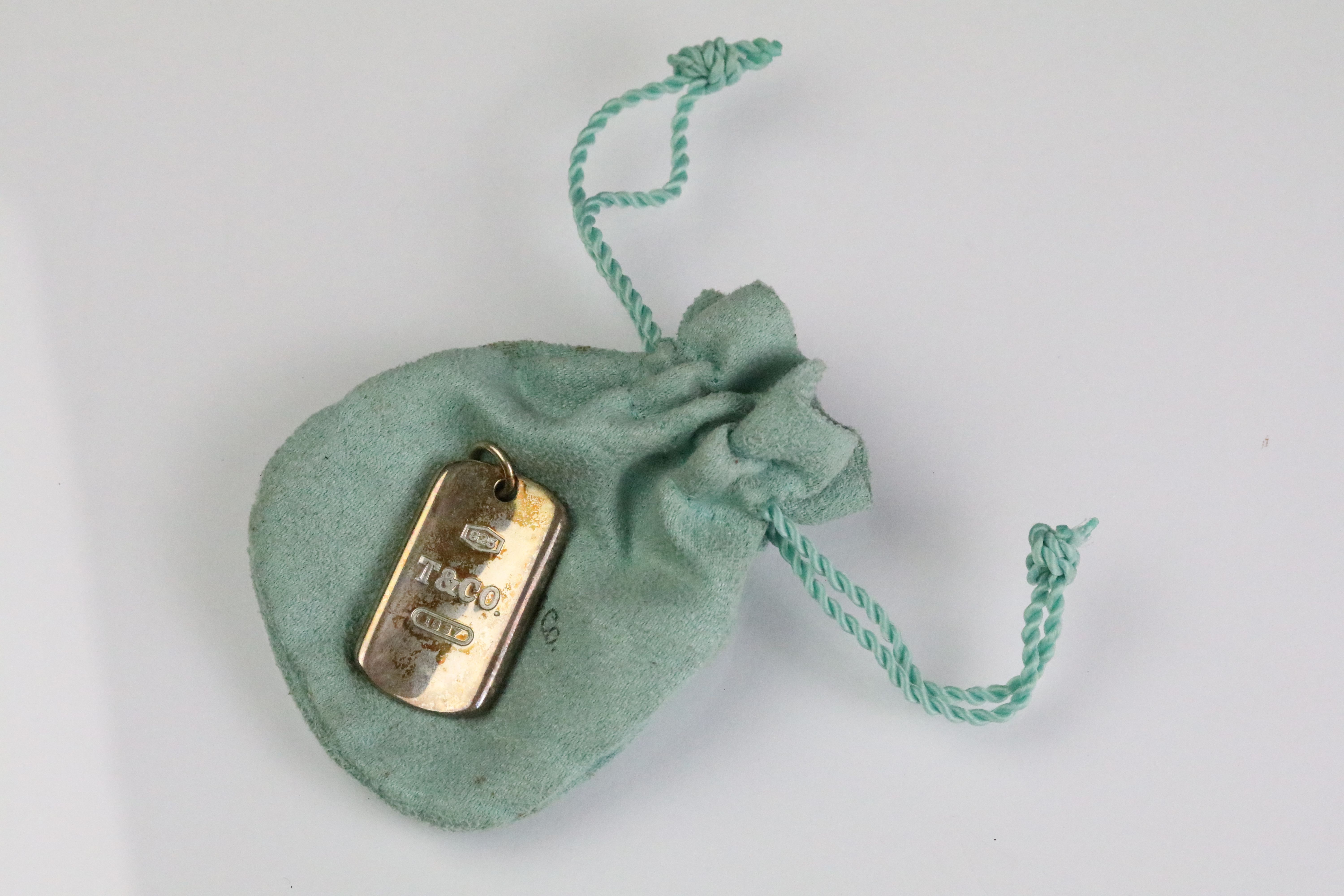 Tiffany & Co silver pendant with drawstring pouch. Marked Tiffany & Co 925. Measures 4.3cm.