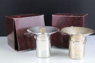 Pair of Georg Jensen Scandinavian silver candle holders having flared rims on cylindrical bases.