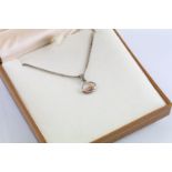 Clogau silver pendant necklace having a fine link chain with oval pierced pendant with rose gold