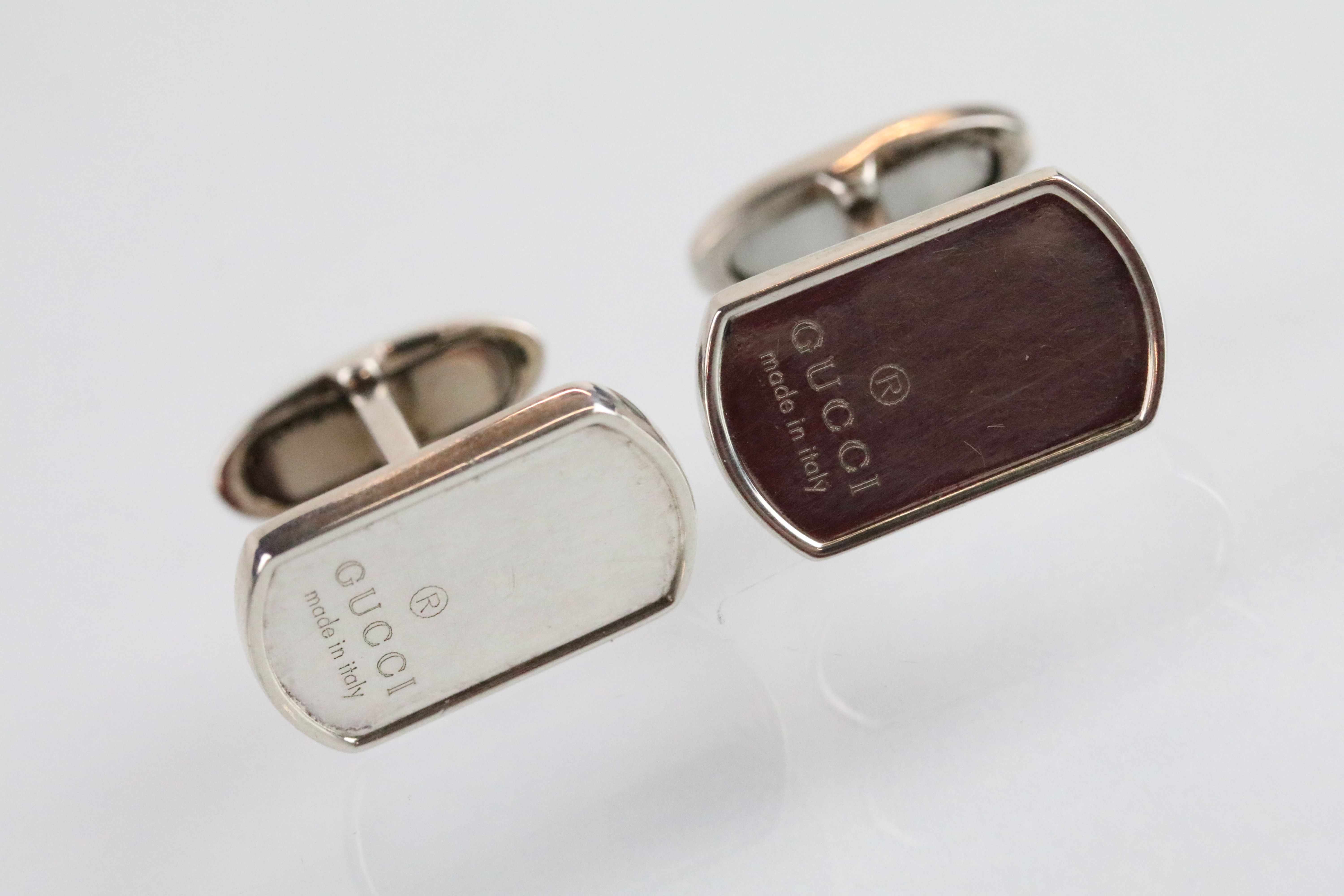 Gucci - a pair of silver cufflinks having rectangular heads engraved Gucci with hinged fasteners. - Image 2 of 4