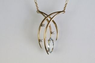 9ct gold hallmarked topaz and diamond necklace. The necklace having a marquise cut topaz and three