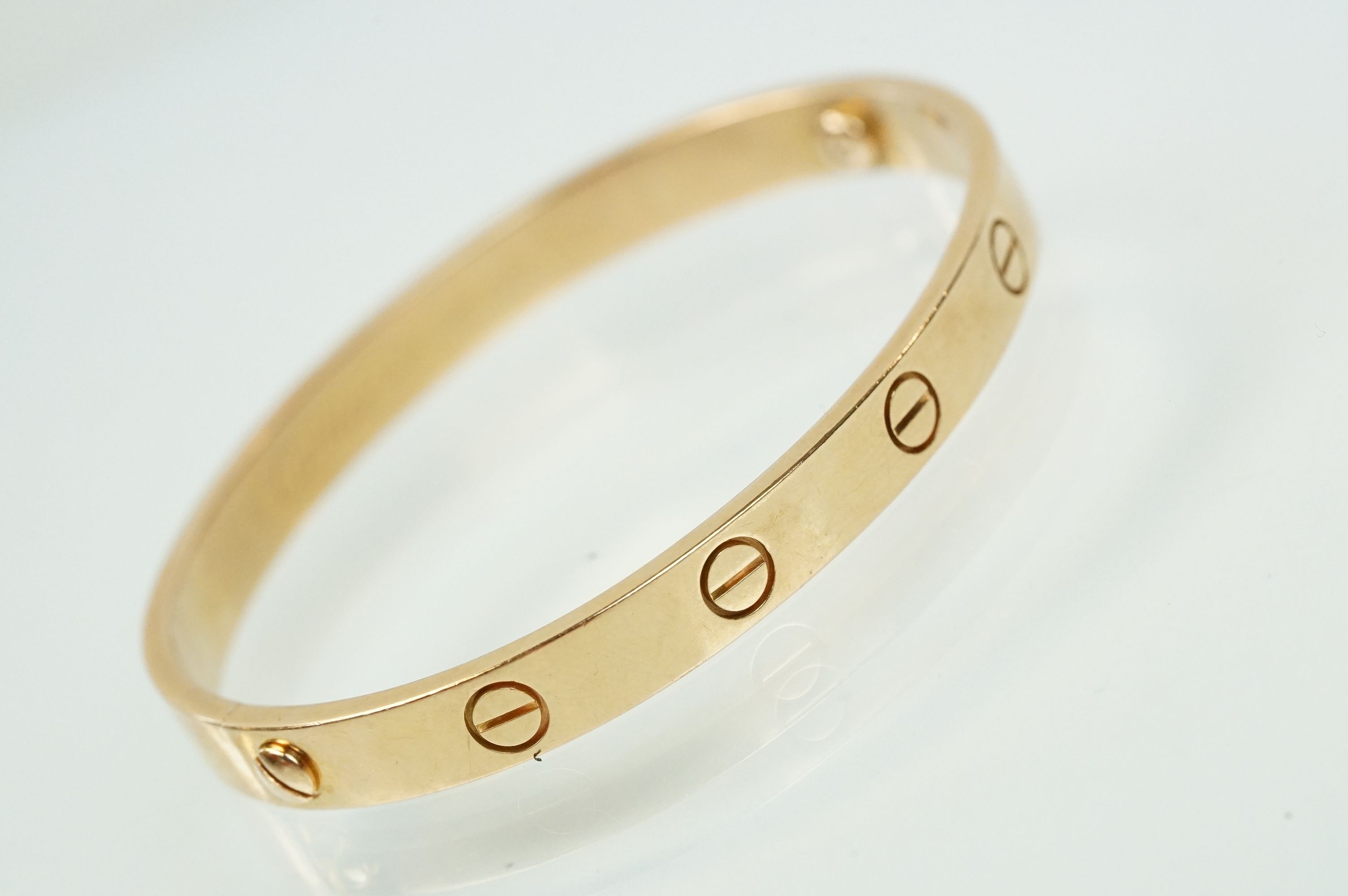 Cartier - 18ct gold 'love' bangle bracelet of oval form with screw detailing. Signed Cartier with - Image 2 of 11