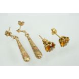 Two pairs of gold earrings to include a pair of two tone drop earrings (marked 375 to posts) and a