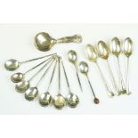 Group of silver hallmarked spoons to include a George III shell pattern caddy spoon (hallmarked
