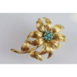 18ct gold and turquoise flower brooch. The brooch constructed from textured gold with a cluster of