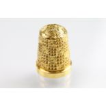 9ct gold hallmarked thimble with moulded details, size 15. Hallmarked Birmingham 1902, HG & S Ltd.