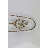 Early 20th Century Edwardian 15ct gold peridot and seed pearl pendant having an open work foliate