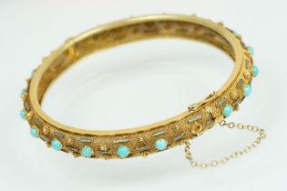 14ct gold turquoise and enamel hinged bangle bracelet. The round bangle having a mesh body set