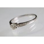 Diamond solitaire ring being set with a round brilliant cut diamond in a cathedral setting with