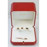 Cartier - 18ct gold 'love' bangle bracelet of oval form with screw detailing. Signed Cartier with