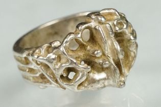 Scandinavian silver brutalist ring having an organic form head with pierced details. Marked 925S,