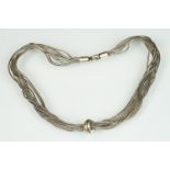 Scandinavian silver multi chain necklace having ten wheat link chains with knot design pendant to