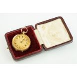 14ct gold open face pocket fob watch having a gilt face with foliate details and roman numerals to