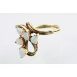 18ct gold and opal ring set with five tear drop shaped opal cabochons with diamond accent stones.