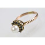 Gold pearl and blue stone ring. The ring being set with a pearl to cultured centre with a halo of