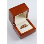 Clogau two tone 9ct gold ring having a pierced foliate knot to head set with diamond accent