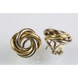 Pair of two tone 18ct gold knot design stud earrings with hinged fastenings. Both marked 750 with