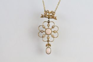 Early 20th Century 15ct gold and opal open work pendant necklace. The necklace having a round opal